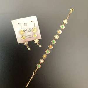 SET ORECCHINI E BRACCIALE ACCIAIO COLOR ORO FIORELLINI